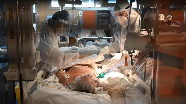 Medical workers treat a patient in the COVID Intensive Care Unit at the Casal Palocco hospital, near Rome. Picture: AFP