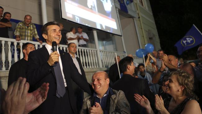 Georgia's billionaire politician Bidzina Ivanishvili, left, with supporters at his office in Tbilisi in 2012. Picture: AP