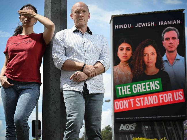 2/10/2024: Joshu Turier and Roz (who is too afraid to be fully identified) ,are two of the trio behind the Jewish Collective, which is plastering billboards around Brisbane saying the Greens have lost their vote, this one is in Chapel Hill, Brisbane. pic: Lyndon Mechielsen/The Australian