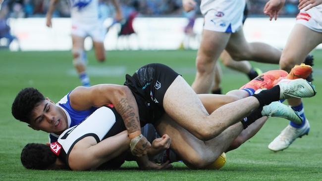 Paul Curtis was handed three weeks for this tackle on Port Adelaide’s Josh Sinn. Picture: James Elsby/AFL Photos via Getty Images