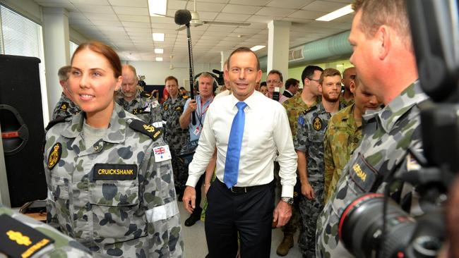 Then-Prime Minister Tony Abbott meets with sailors to thank them for their service during Operation Sovereign Borders on board HMAS Coonawarra in Darwin.