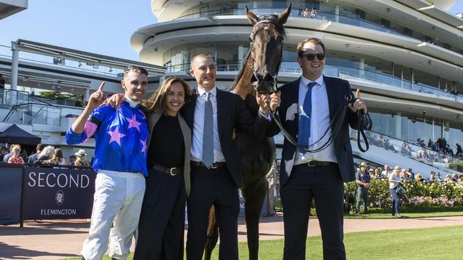 Billy Egan with trainer Dominic Sutton and Raquel Bennett after Feroce’s victory in the Australian Guineas at Flemington on Saturday Picture: Vince Caligiuri/Getty Images