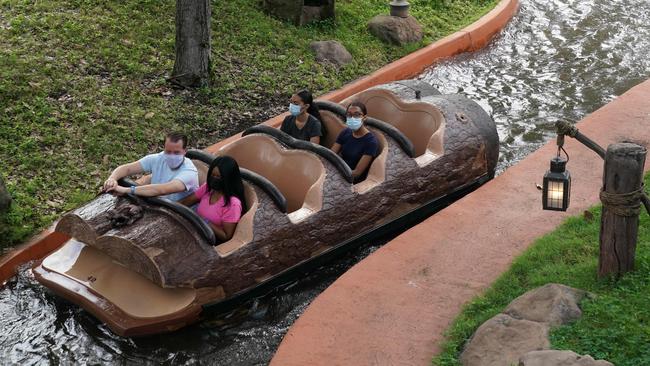 Social distancing seating measures are in place as people wearing facemasks ride Splash Mountain at Walt Disney World Resort's Magic Kingdom. Picture; AFP.