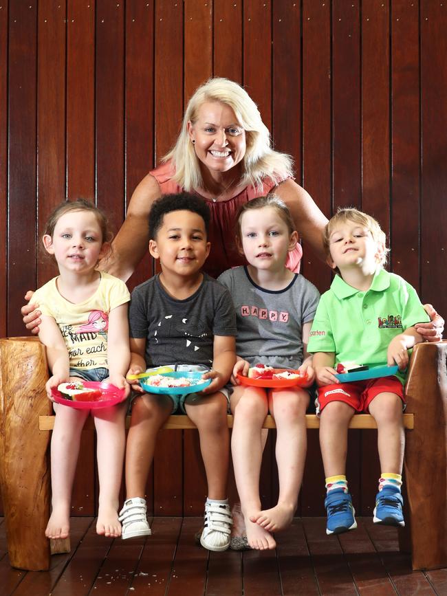 Karla Gilbert with 4 year olds (L-R) Katie Ross, Omari Mapako, Pyper Lavaring, Jaxon Miller at Kool Kids Nerang. Photograph: Jason O'Brien