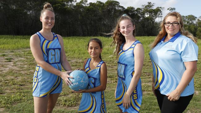 Players Ellie Carlson, 20, Ziahn Malopito, 10, Amanada Mawston, 17, and North Lakes Blues Netball Club president Samantha Malopito on the vacant land that will become their netball courts. PICTURE:  AAP Image/Regi Varghese