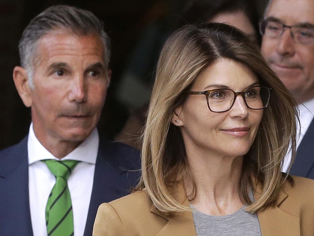 Lori Loughlin looked surprisingly upbeat on her way into court. Picture: AP Photo/Steven Senne