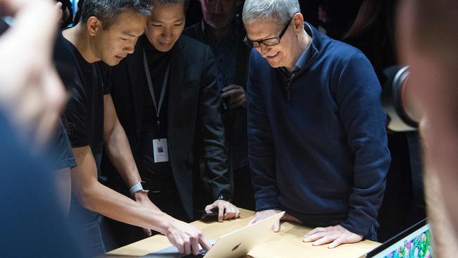 Apple CEO Tim Cook previews a MacBook Pro during a product launch event at Apple headquarters in 2016. Picture: AFP PHOTO / Josh Edelson