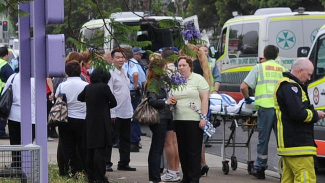 Roger Dean, the man arrested over the Quakers Hill nursing home fire is pictured in the crowd as residents are evacuated from the nursing home.