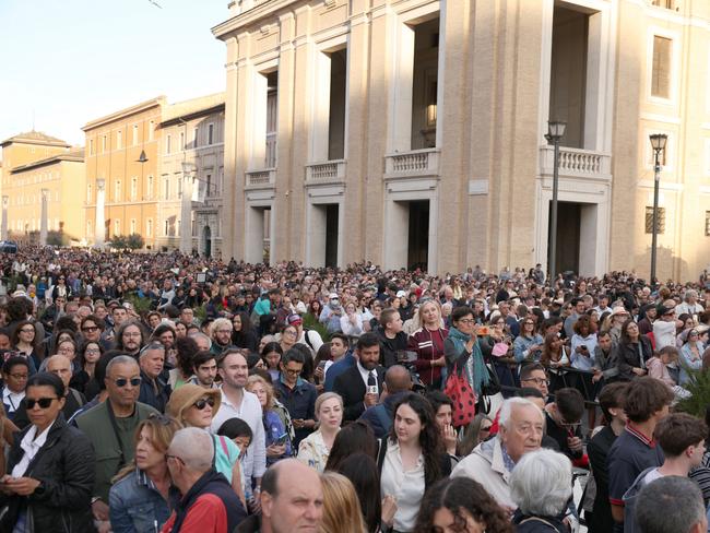 The faithful watch for smoke from the chimney of the Sistine Chapel as conclave gets underway to elect the new pope. Picture: Getty Images