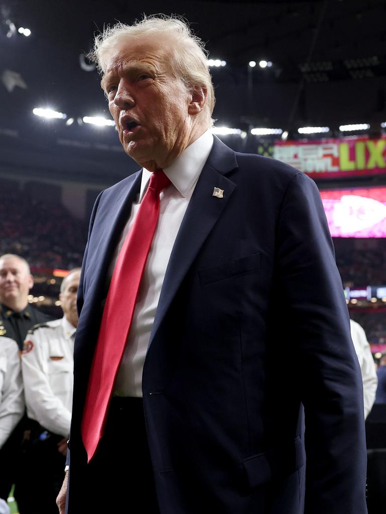 Trump stuck around for the first half. (Photo by Jamie Squire/Getty Images)