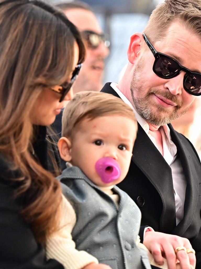 Culkin near his partner Brenda Song and their son during a ceremony. Picture: Frederic J. BROWN / AFP