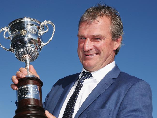 MELBOURNE, AUSTRALIA - OCTOBER 14:  Darren Weir, trainer of Tosen Stardom, holds up the trophy after winning race 9 the United Petroleum Toorak Handicap  during Melbourne Racing on Caulfield Guineas Day at Caulfield Racecourse on October 14, 2017 in Melbourne, Australia.  (Photo by Michael Dodge/Getty Images)