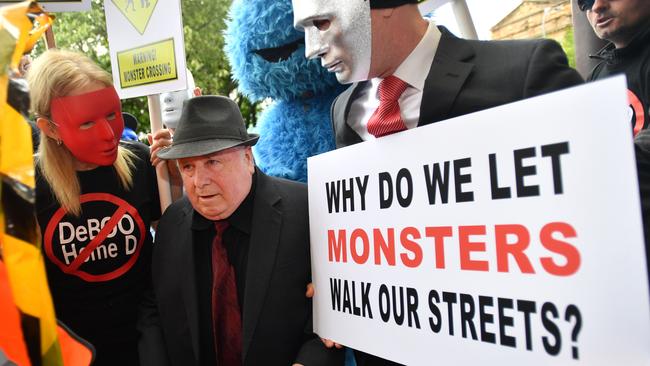 Vivian Frederick Deboo ran a gauntlet of victims and their supporters when he arrived at the District court in Adelaide in November. Picture: AAP Image/David Mariuz