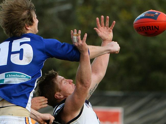 NFL: Bundoora V Macleod. Macleod's Daniel O'Brien punches from Bundoora's Gary Moorcroft.