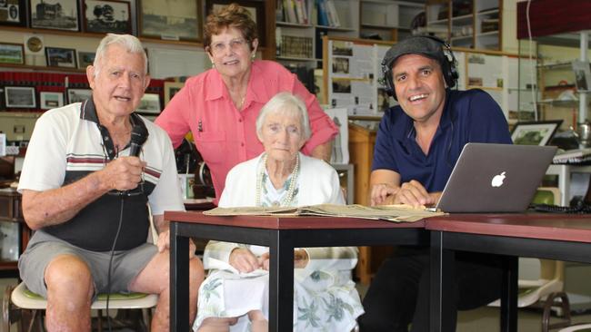 Linda Paddon shared memories for the inaugural Sandgate Bay of Lights Project in 2018 with Bert Midgley, Sandgate Historical Society president Pam Verney (standing) and local filmmaker Dean Gibson (Bacon Factory Films). Picture: Michelle Smith