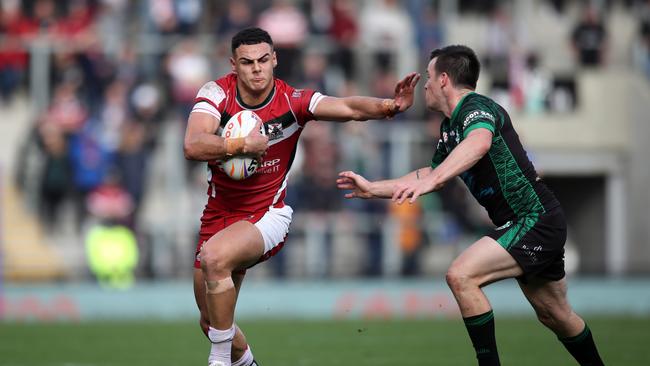 LEIGH, ENGLAND - OCTOBER 23: Jacob Kiraz of Lebanon holds off Joe Keyes of Ireland during the Rugby League World Cup 2021 Pool C match between Lebanon and Ireland at Leigh Sports Village on October 23, 2022 in Leigh, England. (Photo by Jan Kruger/Getty Images for RLWC)