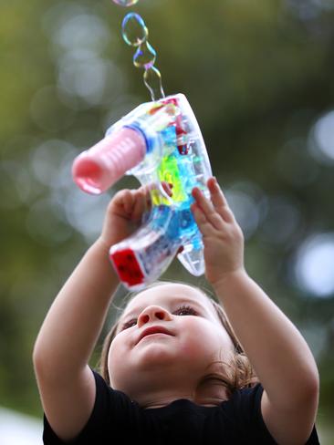 2 year old Reuben plays with some bubbles at Parramasala on Saturday.