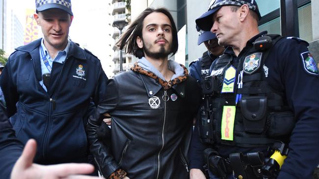 Environmental activist Eric Herbert, pictured here during his arrest on July 17, has taken part in several protests in Brisbane’s CBD. Picture: Dave Hunt/AAP