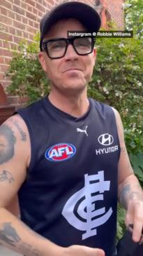 Pop legend goes undercover in AFL jersey