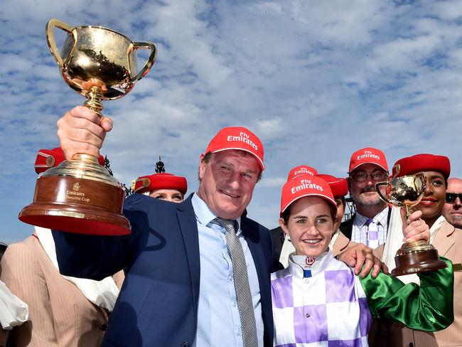 Darren Weir and Michelle Payne celebrate Pride of Penzance’s Melbourne Cup win in 2015. Picture: Jay Town