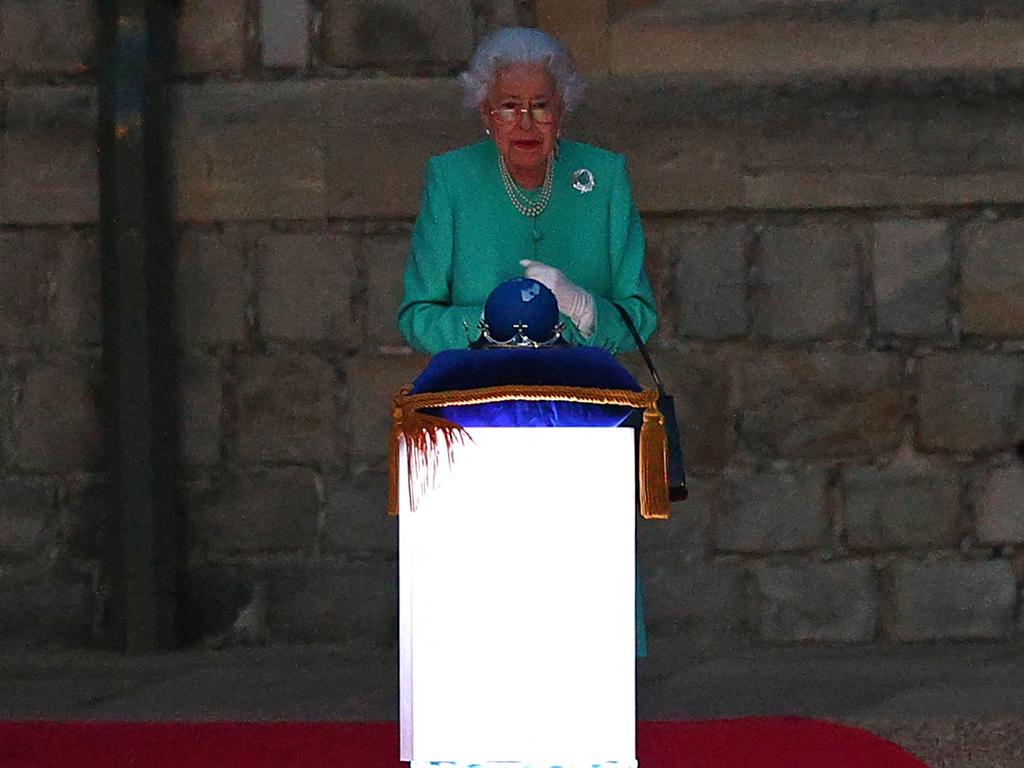 Britain's Queen Elizabeth II lights the principle beacon. Picture: AFP