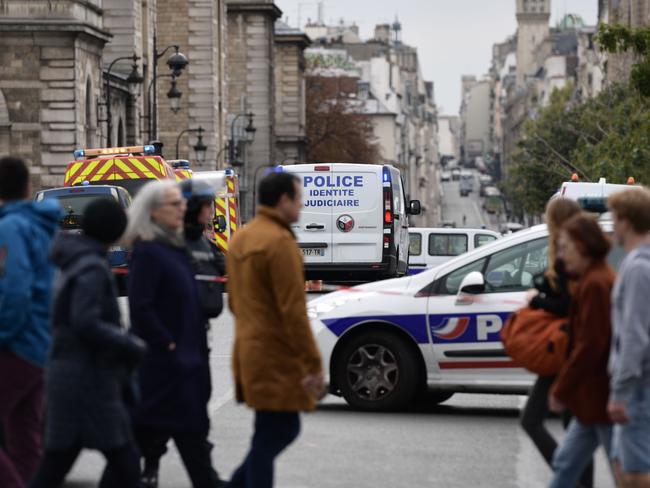 People walk near the scene of the attack. Picture: AFP