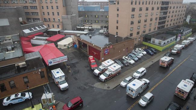 Ambulances queue outside the Elmhurst Hospital Center's Trauma Center, in the Queens borough of New York, on Sunday. Picture: AP