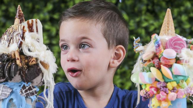 Three-year-old Eddie with some of the milkshakes at Sweet Espresso. Picture: Wayne Taylor