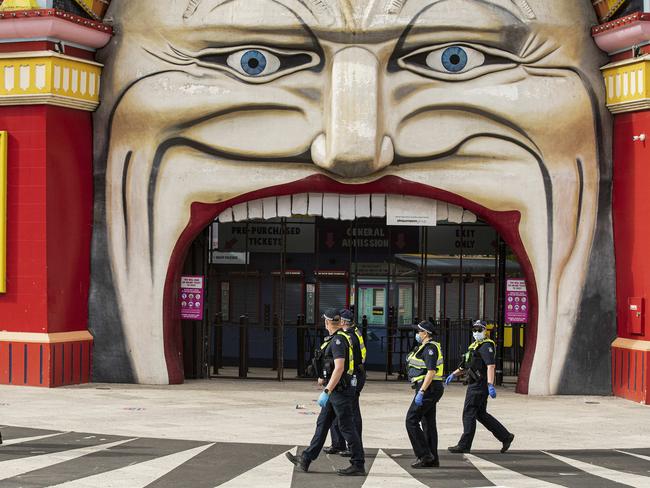 MELBOURNE, AUSTRALIA - NCA NewsWire Photos October 4, 2020:  Police patrols are seen walking past Luna Park in St Kilda, Melbourne, Victoria. Picture: NCA NewsWire / Daniel Pockett