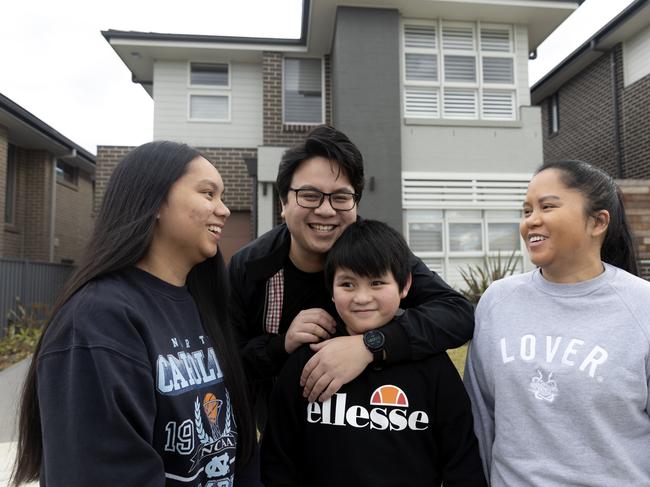 New homeowners Jan and Ceilene Catarroja with their children Grace and Lucas outside of their home in Riverstone, Sydney. Picture: Nikki Short