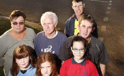 We do exist: Norvell Grove residents stand under their new street sign after council changed its name from Ellis Road. Picture: Jerad Williams