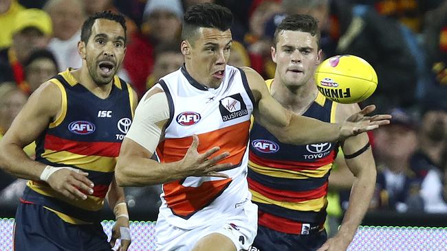 Dylan Shiel juggles the ball away from Eddie Betts and Brad Crouch. Picture: Sarah Reed