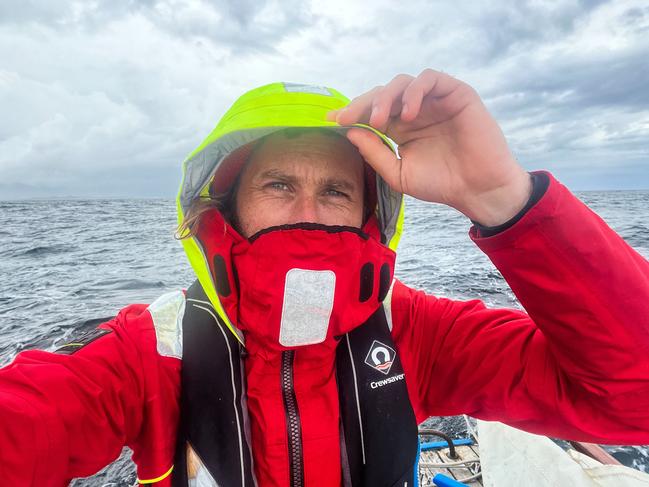 Nick Jaffe takes a selfie during his solo boating journey across Bass Strait in an open cockpit couta boat called Huia. His old wooden boat will be one of the hundreds of boats on display in Hobart as part of the Australian Wooden Boat Festival. Picture: Nick Jaffe (Instagram @nick_jaffe)