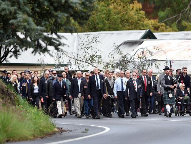 Veterans and supporters march behind bagpipe player Lachlan McSwain. Picture: Steve Tanner