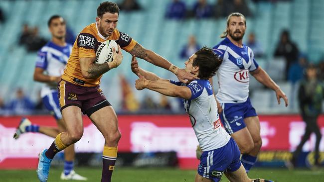 Darius Boyd tries to palm his way through. Picture: Brett Hemmings/Getty Images