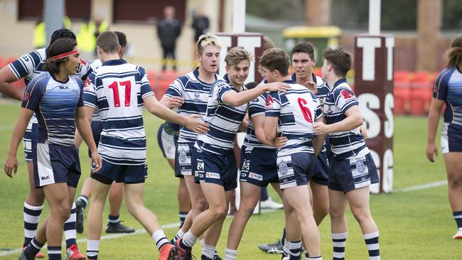 FROM THE FRONT: St Mary's celebrate Blake Moore's (number 6) try against Coombabah State High School. Photo: Nev Madsen