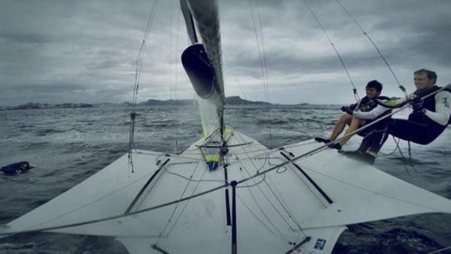 Nathan Outteridge and Iain Jensen sailing past a dead dog in Rio.