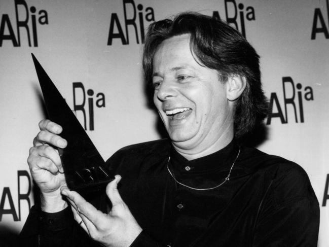 Tommy Emmanuel with one of his ARIA Awards.