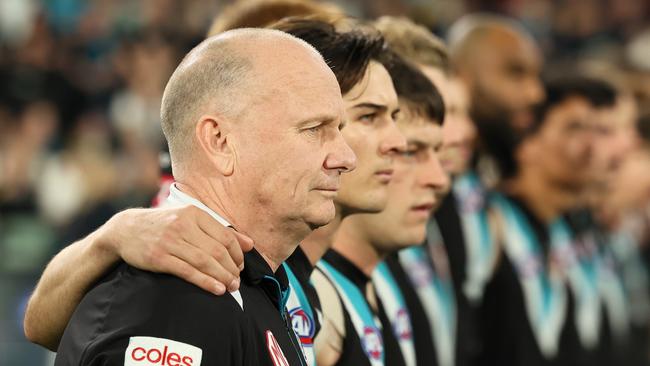 ADELAIDE, AUSTRALIA - SEPTEMBER 05: Ken Hinkley, Senior Coach of the Power during the national anthem during the 2024 AFL Second Qualifying Final match between the Port Adelaide Power and the Geelong Cats at Adelaide Oval on September 05, 2024 in Adelaide, Australia. (Photo by James Elsby/AFL Photos via Getty Images)