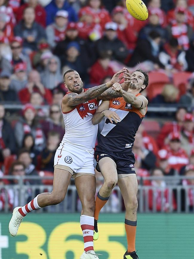 Lance Franklin up against Phil Davis before the Giant left the field on Saturday. Picture: Brett Hemmings/AFL Media/Getty Images