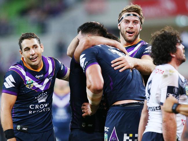 Billy Slater and Christian Welch celebrate a try against the Cowboys.