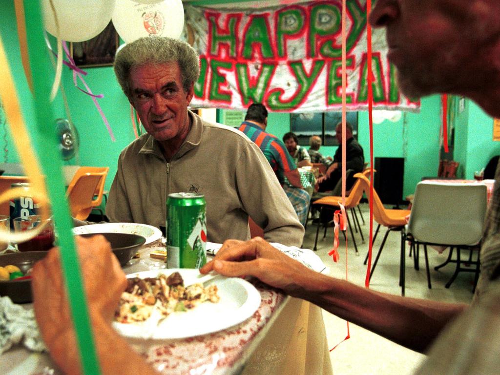 Homeless man Barry Pollard enjoys NYE meal at Brisbane City Mission, New Years Eve 1999. Picture: Patrick Hamilton