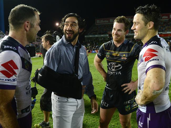 NRL Round 22. NQ Cowboy's Johnathan Thurston and Michael Morgan chat with Melbourne Storm's Cameron Smith and Cooper Cronk after the match at 1300SMILES Stadium, Townsville, Queensland. Picture: Wesley Monts