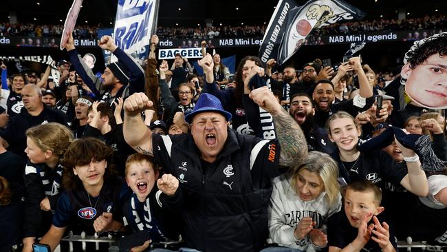 Blues fans celebrate the team’s nailbiting two-point win over Melbourne at the MCG on Friday night. Picture: Getty Images