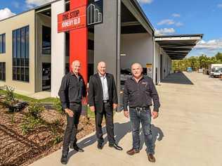 NEW HORIZONS: CBRE's Glen Grimish, centre, with OSJ general manager Pat Meyer and OSJ co-owner Graham Taylor at 39-41 Claude Boyd Pde, Bells Creek. Picture: AEE Jack Gore