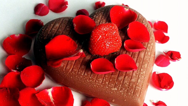 Heart shaped chocolate dessert cake and fresh strawberry for Saint Valentine's Day. valentines /Food /Cakes