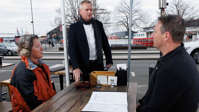 Tasmanian premier Jeremy Rockliff chats with Victorian visitors Jean Blakey and Matt Simon at a cafe on Hobart’s waterfront. Picture: Peter Mathew