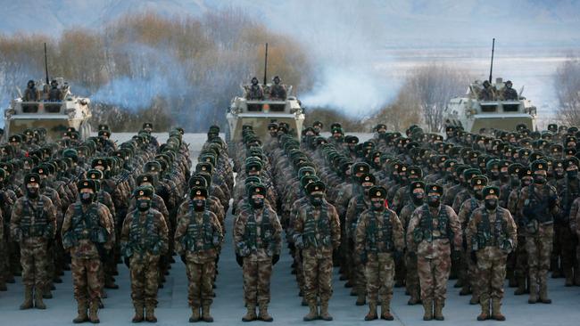 Chinese People's Liberation Army (PLA) soldiers assemble during military training at Pamir Mountains in Kashgar, northwestern China's Xinjiang region.