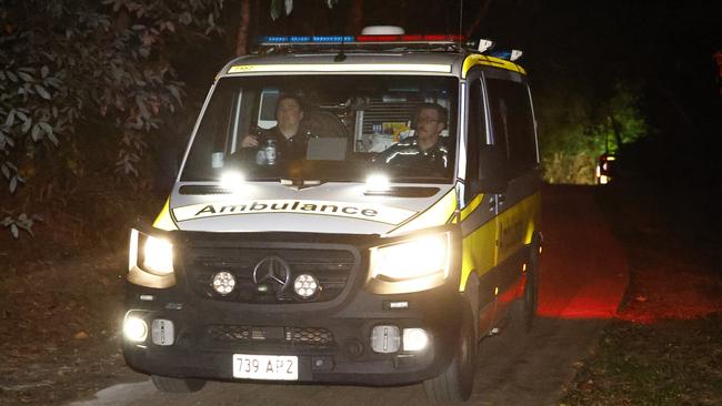 Police officers and QAS paramedics attend an emergency scene at the Crystal Cascades swimming hole in the Redlynch Valley, where 2 men aged 21 and 59 drowned on Tuesday afternoon. Picture: Brendan Radke