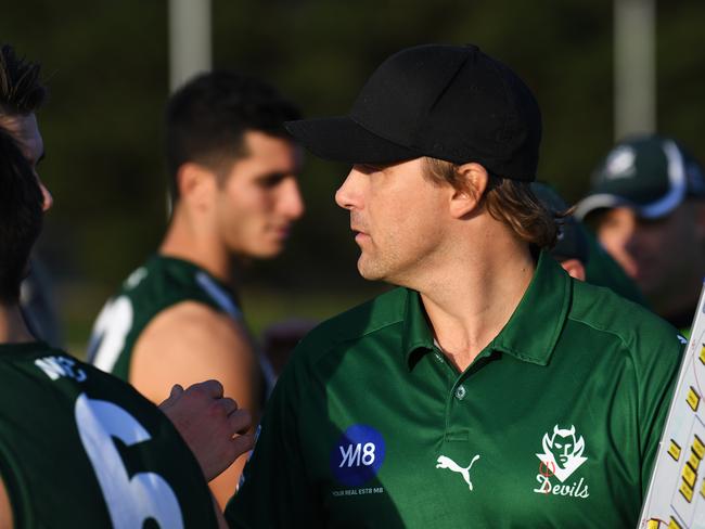 Wantirna South coach Jess Sinclair speaks to his players at the 3/4 time  during the EFL Division two match at Walker Reserve, Wantirna South, Melbourne, Saturday, May 26, 2018. Wantirna Sth v Doncaster East. (AAP Image/James Ross) NO ARCHIVING